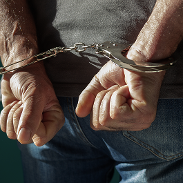 person in handcuffs